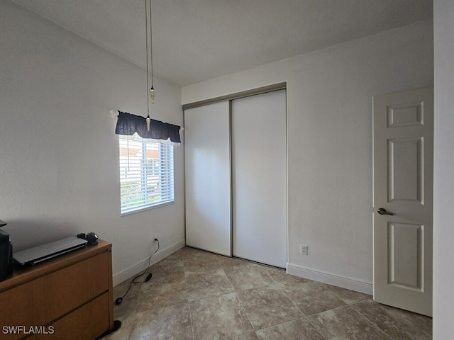 13331 Medinah Cir W Unit 1, Fort Myers, FL 33907 - unfurnished bedroom featuring baseboards and a closet