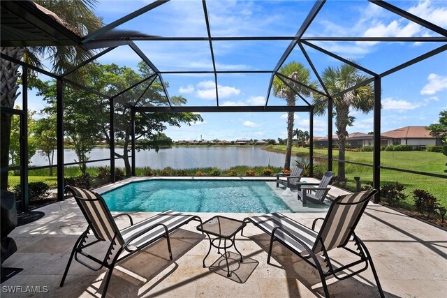 view of pool featuring a lanai, a yard, a water view, and a patio area