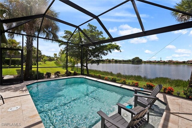 view of pool with a lanai, a water view, and a patio area