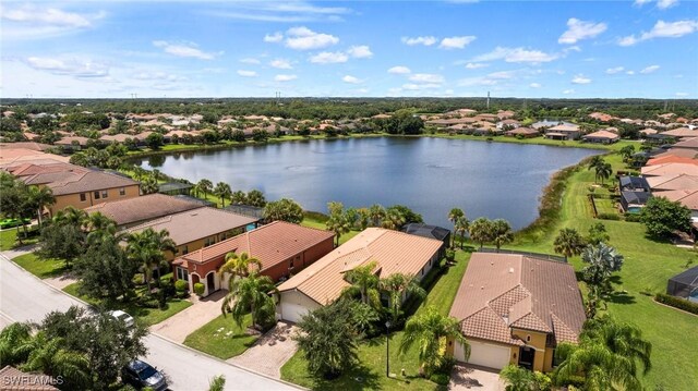 drone / aerial view with a water view