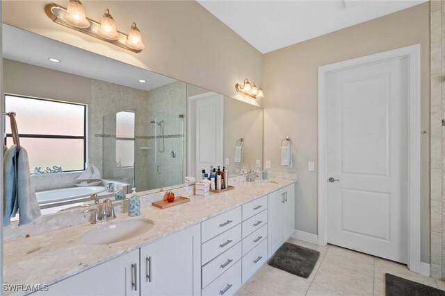 bathroom featuring vanity, separate shower and tub, and tile patterned floors