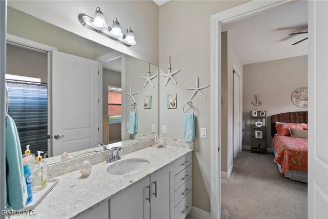 bathroom with ceiling fan and vanity