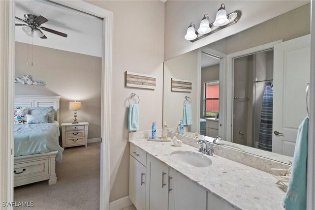 bathroom with vanity, a shower with shower curtain, and ceiling fan