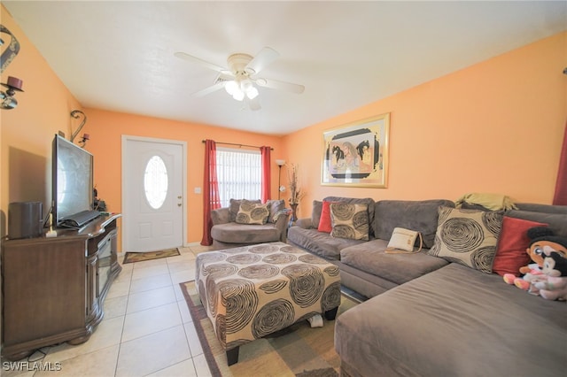 living room with ceiling fan and light tile patterned floors