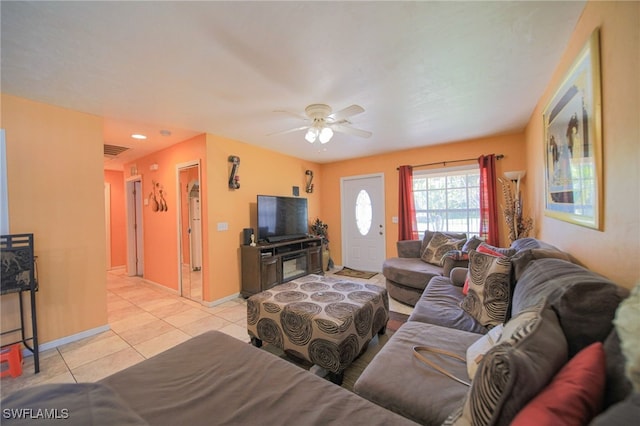 living room featuring ceiling fan and light tile patterned floors