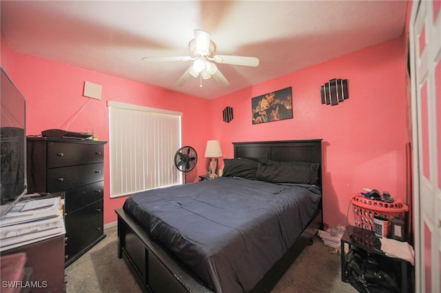 bedroom featuring dark colored carpet and ceiling fan