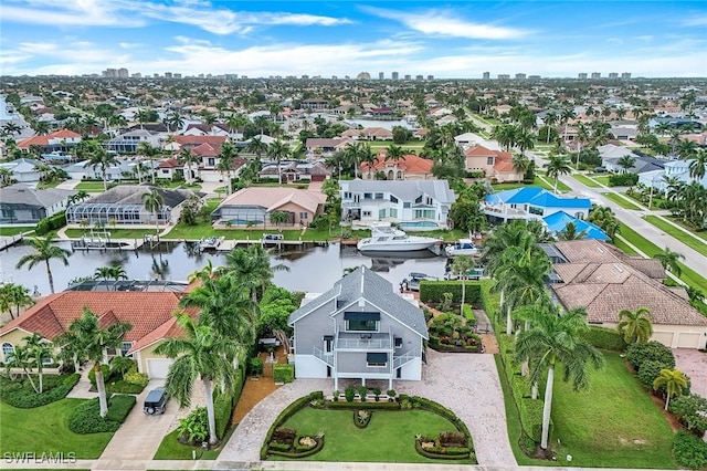 bird's eye view featuring a residential view and a water view