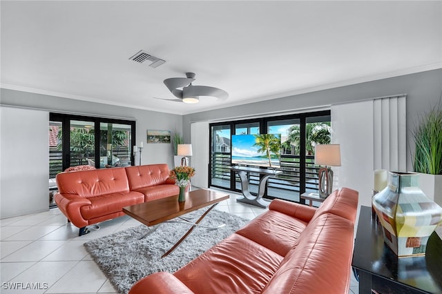 tiled living room with ornamental molding and ceiling fan