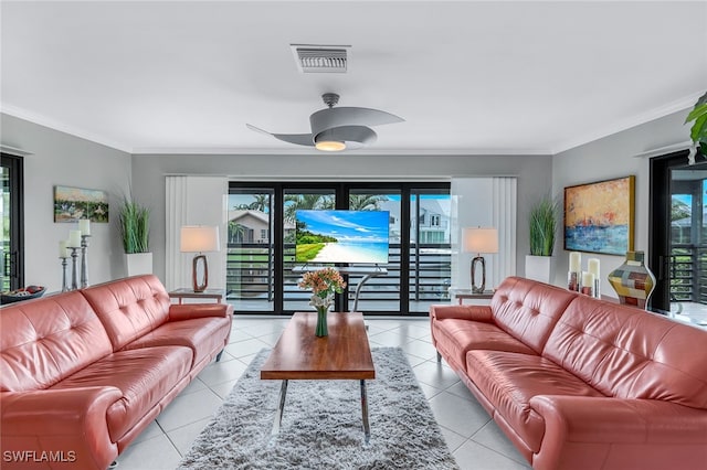 living room with crown molding, a wealth of natural light, light tile patterned floors, and ceiling fan