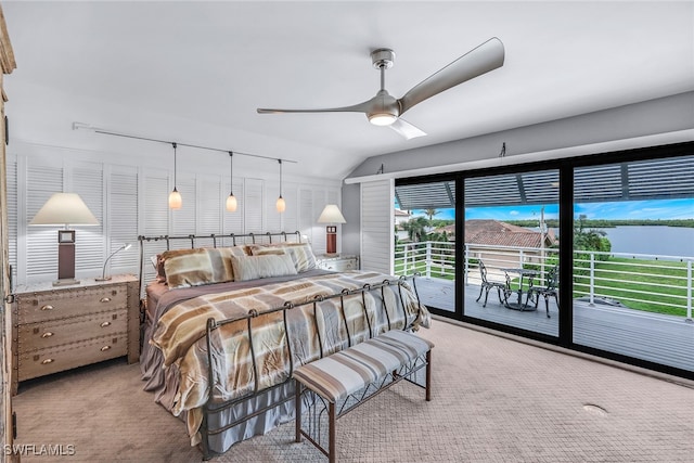 bedroom with carpet flooring, multiple windows, and access to exterior