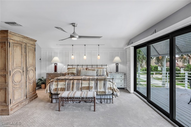 carpeted bedroom with access to exterior and ceiling fan