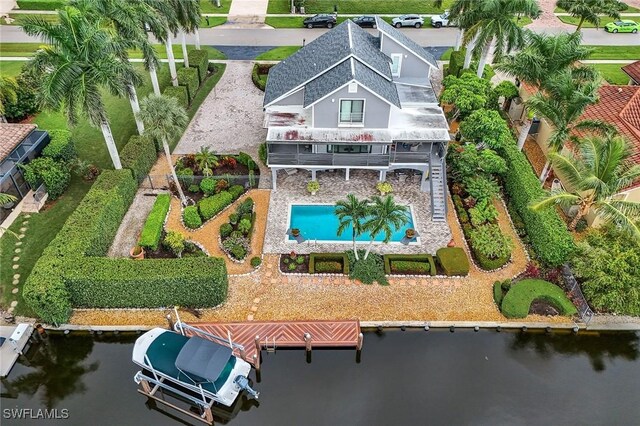 birds eye view of property featuring a water view