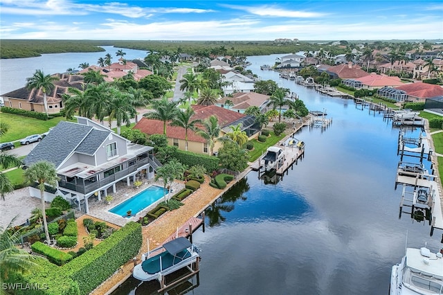 birds eye view of property with a water view