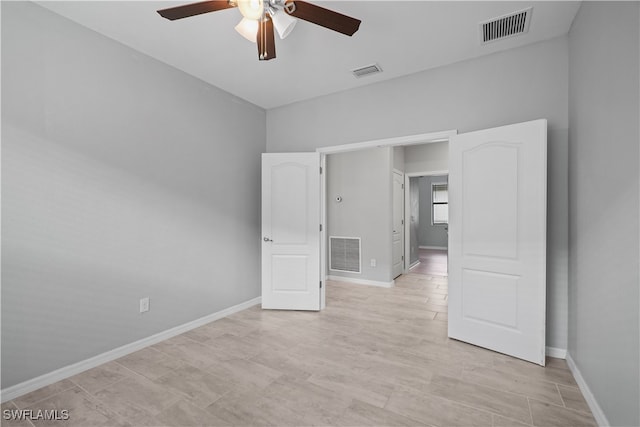 unfurnished bedroom featuring ceiling fan