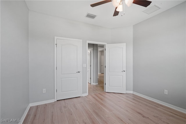 unfurnished bedroom with ceiling fan and light hardwood / wood-style floors