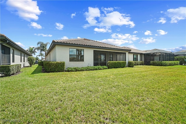 exterior space with a lanai and a front yard