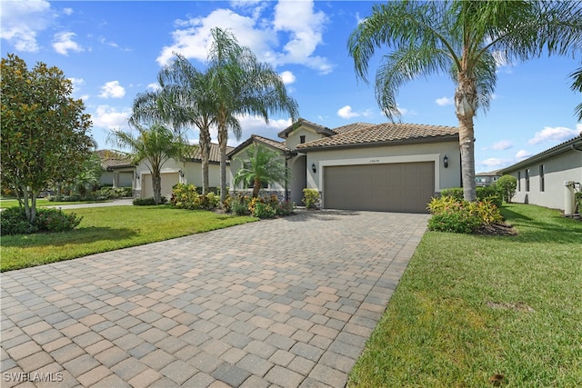 view of front of house with a front lawn and a garage