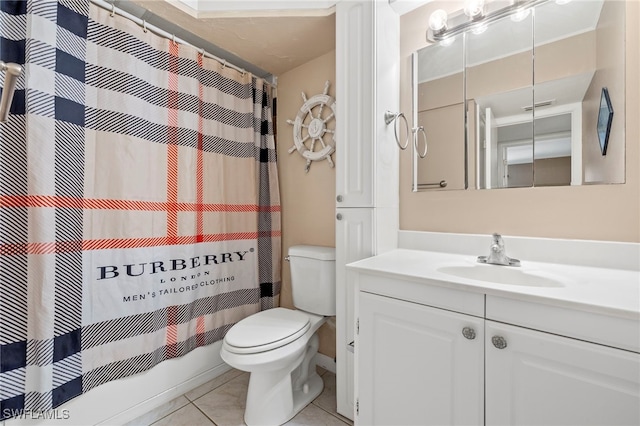 bathroom with a shower with shower curtain, vanity, toilet, and tile patterned floors