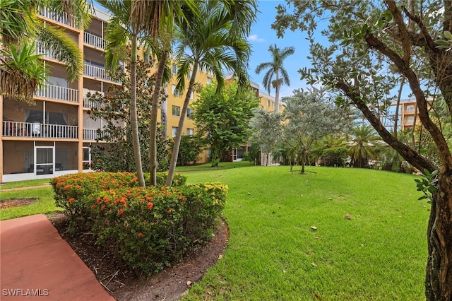 view of home's community featuring a lawn