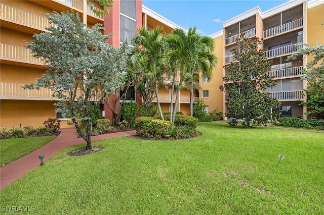 view of home's community featuring a yard