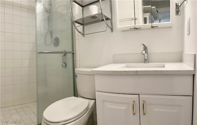 bathroom with a shower with shower door, toilet, and vanity