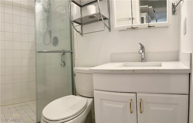 full bathroom with a stall shower, vanity, and toilet