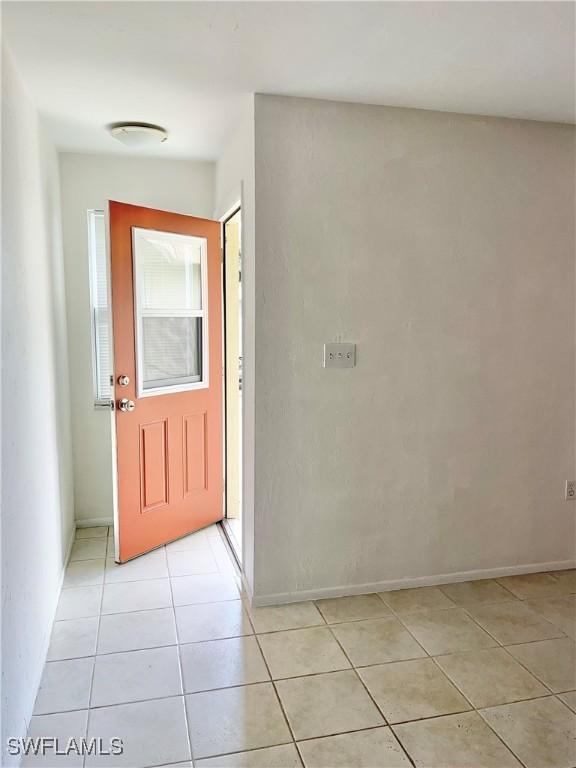 tiled entryway featuring a healthy amount of sunlight