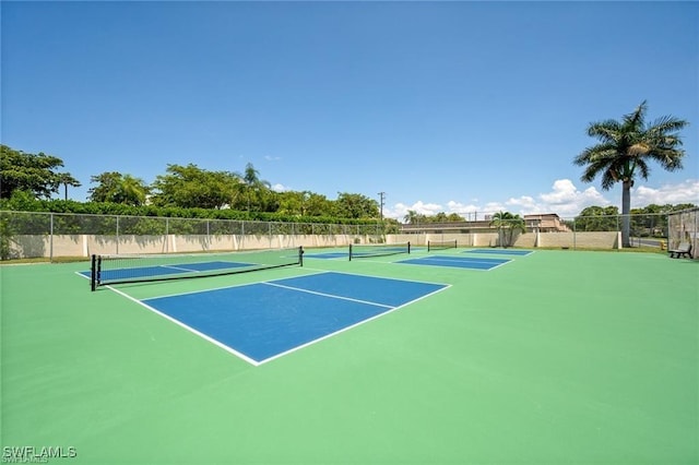 view of tennis court with fence