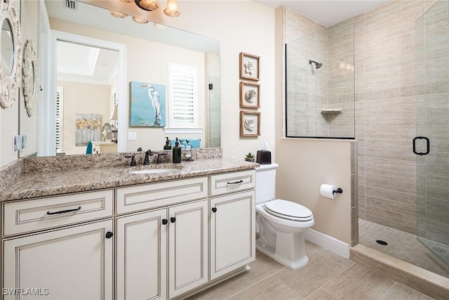 bathroom with tile patterned floors, toilet, an enclosed shower, vanity, and ornamental molding