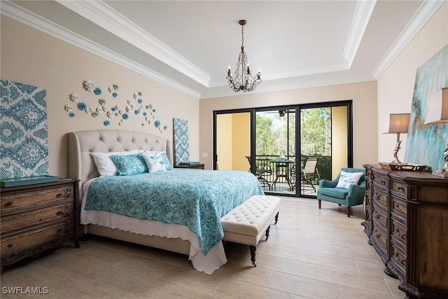 bedroom with a raised ceiling, crown molding, a notable chandelier, and access to exterior