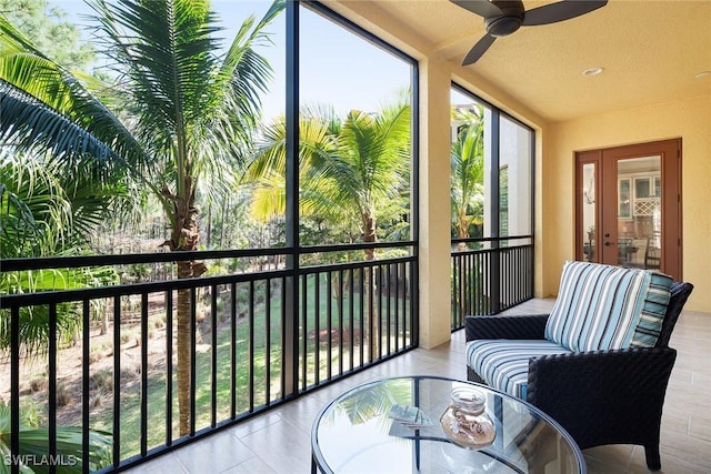 sunroom featuring ceiling fan