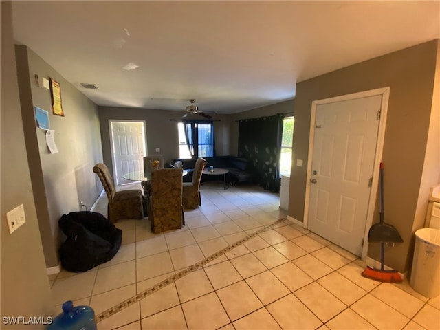 tiled dining room featuring ceiling fan