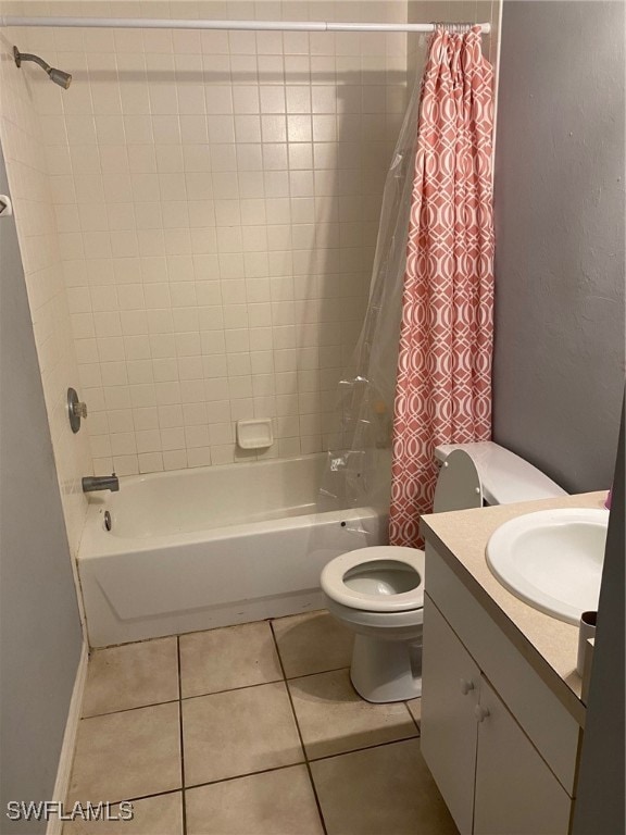 full bathroom featuring toilet, vanity, shower / bathtub combination with curtain, and tile patterned flooring