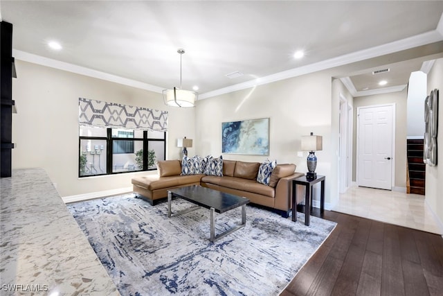 living room with hardwood / wood-style floors and ornamental molding