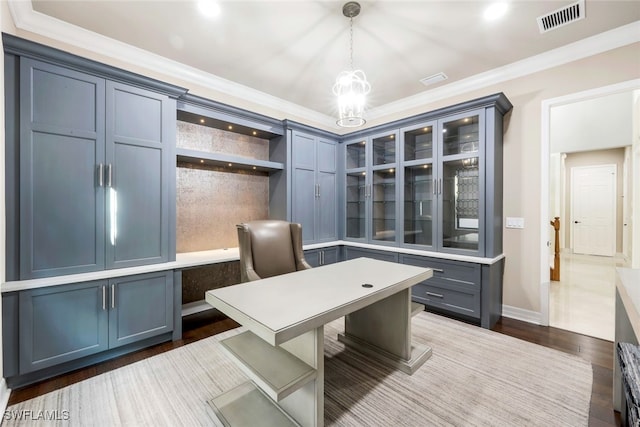 office area with hardwood / wood-style flooring and crown molding