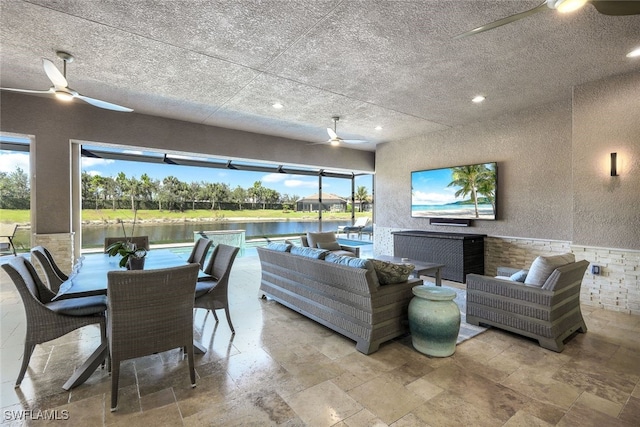 living room featuring ceiling fan