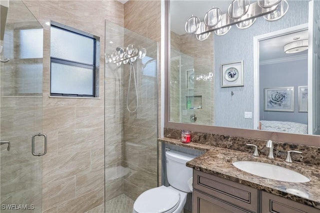 bathroom featuring vanity, toilet, walk in shower, and ornamental molding