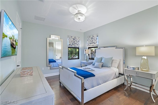 bedroom featuring dark hardwood / wood-style flooring