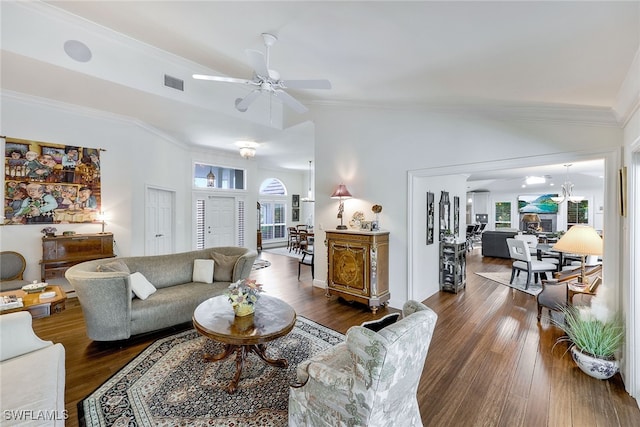 living room featuring lofted ceiling, ceiling fan, dark hardwood / wood-style flooring, and crown molding