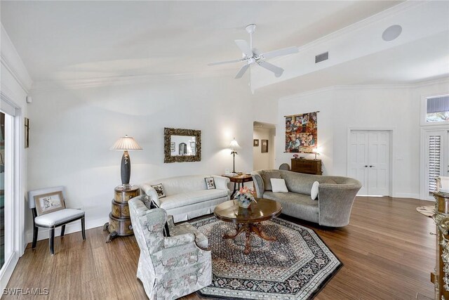 living room featuring crown molding, dark hardwood / wood-style flooring, and ceiling fan