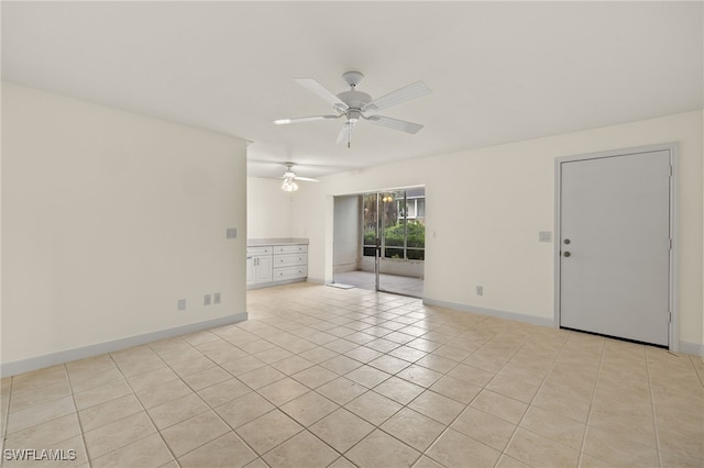 unfurnished room featuring ceiling fan and light tile patterned floors