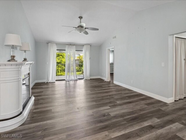 unfurnished living room with ceiling fan, lofted ceiling, and hardwood / wood-style floors