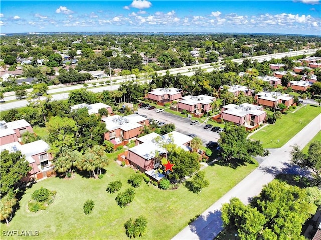 aerial perspective of suburban area with a tree filled landscape