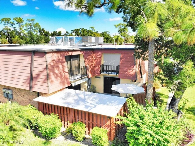 rear view of property with a balcony