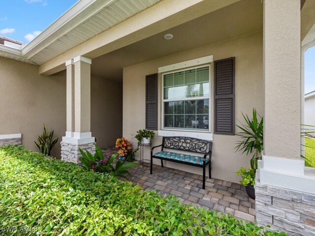 entrance to property with a porch