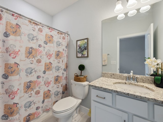 bathroom with a shower with curtain, vanity, and toilet