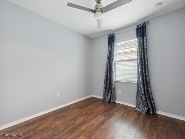 unfurnished room featuring dark hardwood / wood-style floors and ceiling fan