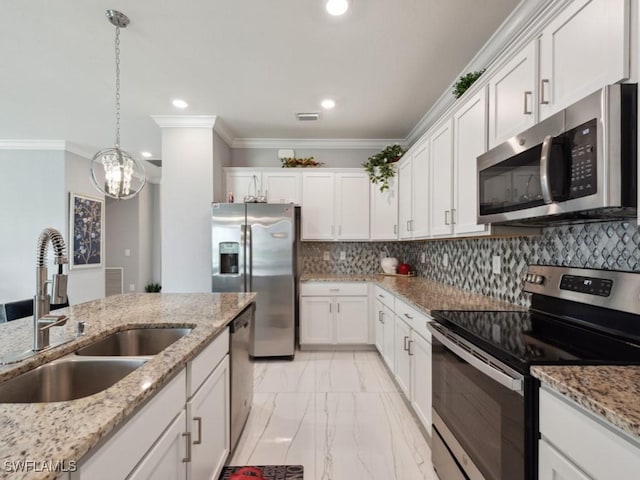 kitchen with sink, backsplash, stainless steel appliances, and white cabinets