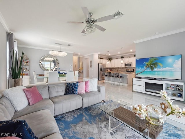 living room featuring ceiling fan and ornamental molding