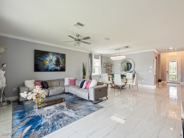 living room with ceiling fan and ornamental molding